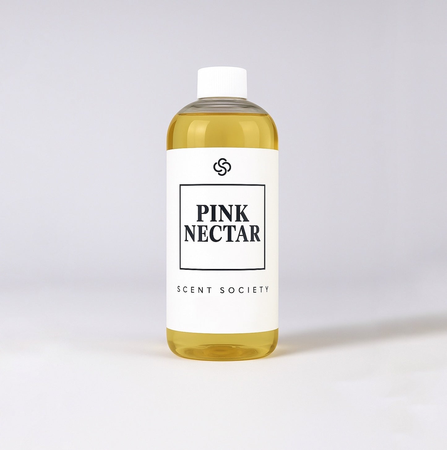 Scent Society diffuser fragrance oil in clear 500ml bottle labeled Pink Nectar, with white cap on neutral background.