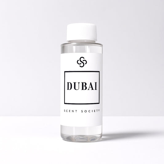 Scent Society diffuser fragrance oil in clear 100ml bottle labeled Dubai, with white cap on neutral background.