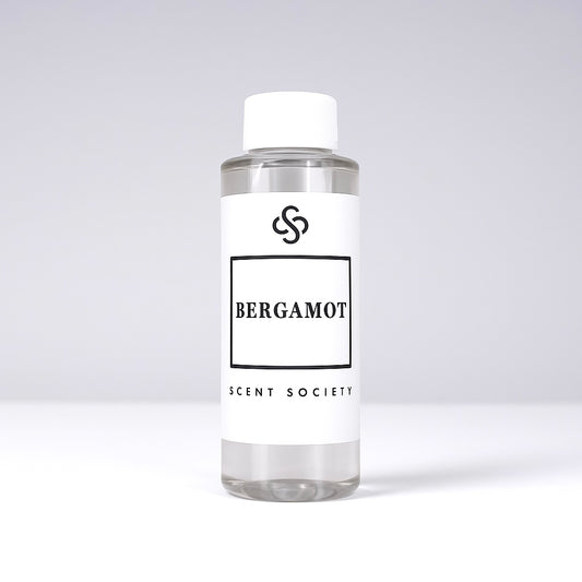 Scent Society diffuser fragrance oil in clear 100ml bottle labeled Bergamot, with white cap on neutral background.