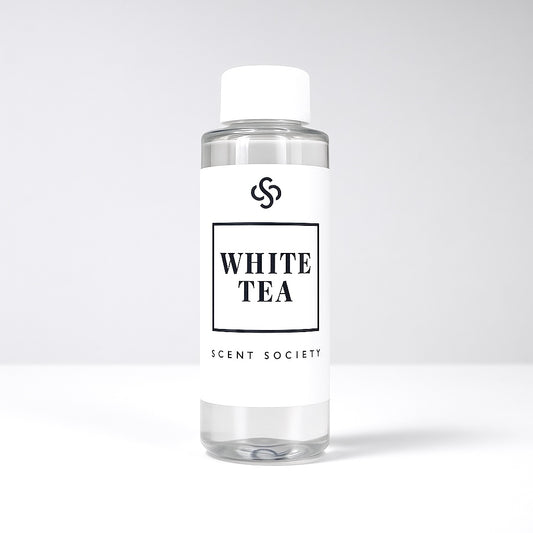 Scent Society diffuser fragrance oil in clear 100ml bottle labeled White Tea, with white cap on neutral background.