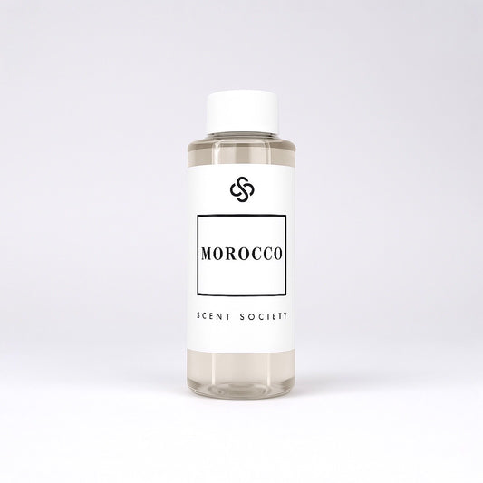 Scent Society diffuser fragrance oil in clear 100ml bottle labeled Morocco, with white cap on neutral background.