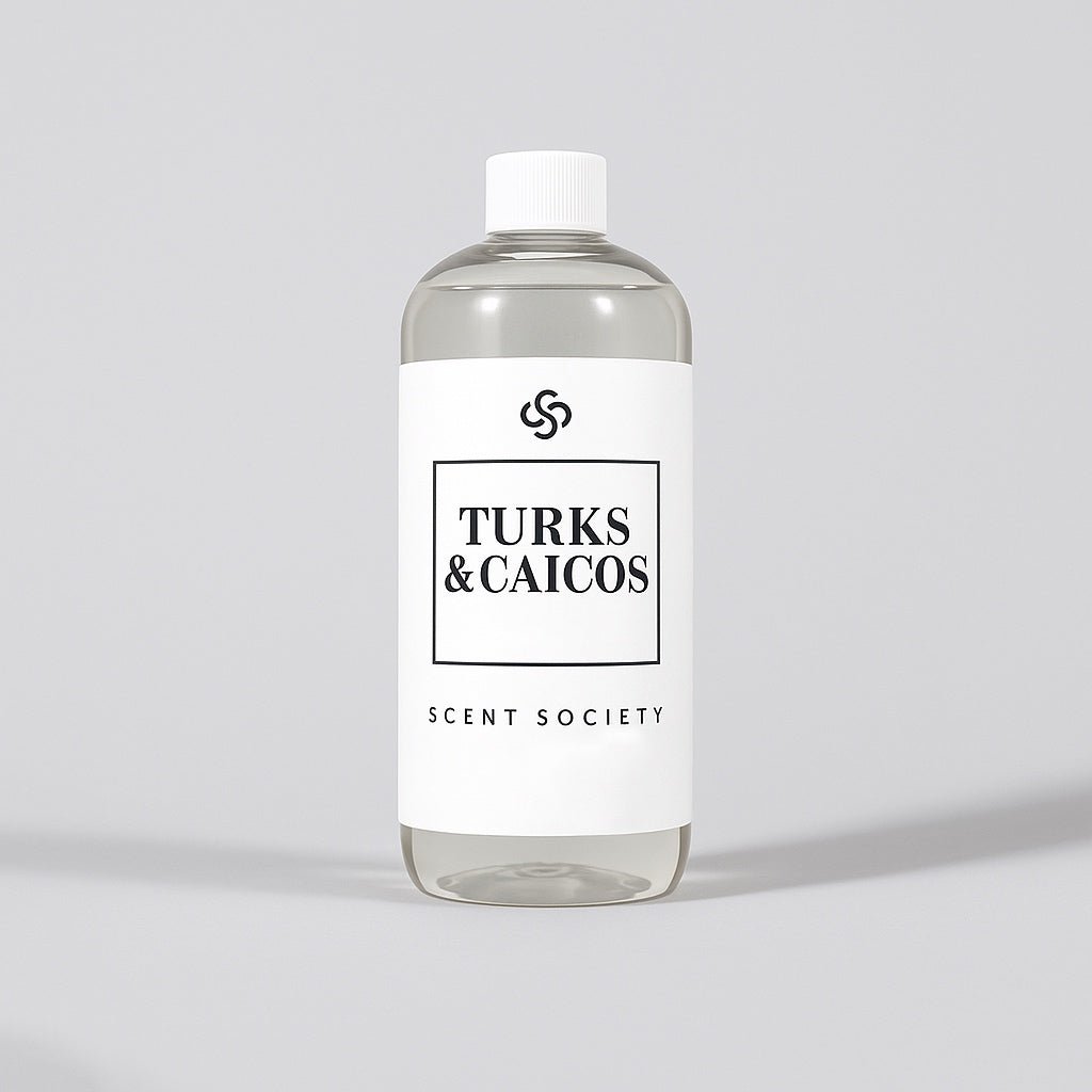 Scent Society diffuser fragrance oil in clear 500ml bottle labeled Turks & Caicos, with white cap on neutral background.