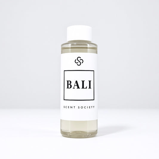 Scent Society diffuser fragrance oil in clear 100ml bottle labeled Bali, with white cap on neutral background.