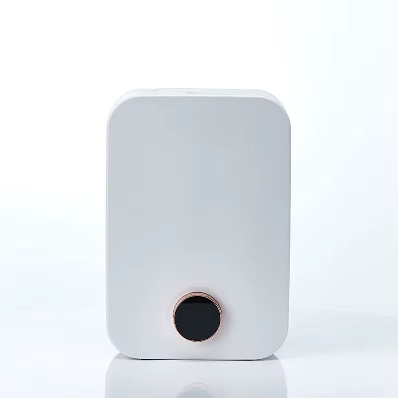 White rectangular scent diffuser with rounded corners and black and gold control dial, photographed from the front against a plain background- modern fragrance diffuser for home or commercial use.