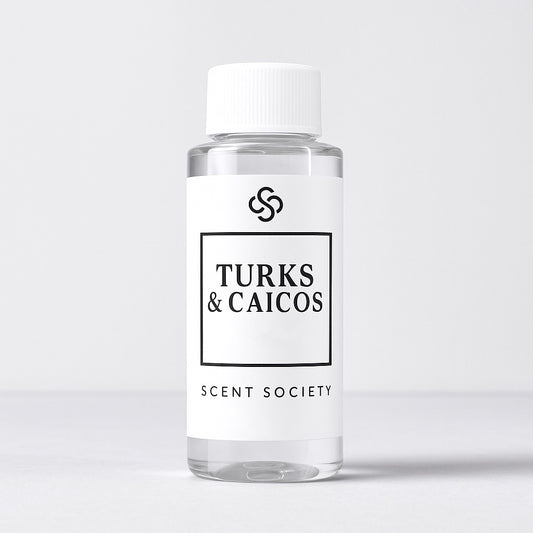 Scent Society diffuser fragrance oil in clear 100ml bottle labeled Turks & Caicos, with white cap on neutral background.