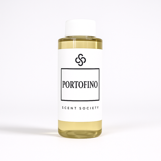 100ml bottle of Scent Society labeled 'PORTOFINO' diffuser oil on a neutral background. Clear plastic bottle with white cap and minimalist black-and-white label, filled with fragrance oil. Aromatherapy oil for use in cold air diffusers.
