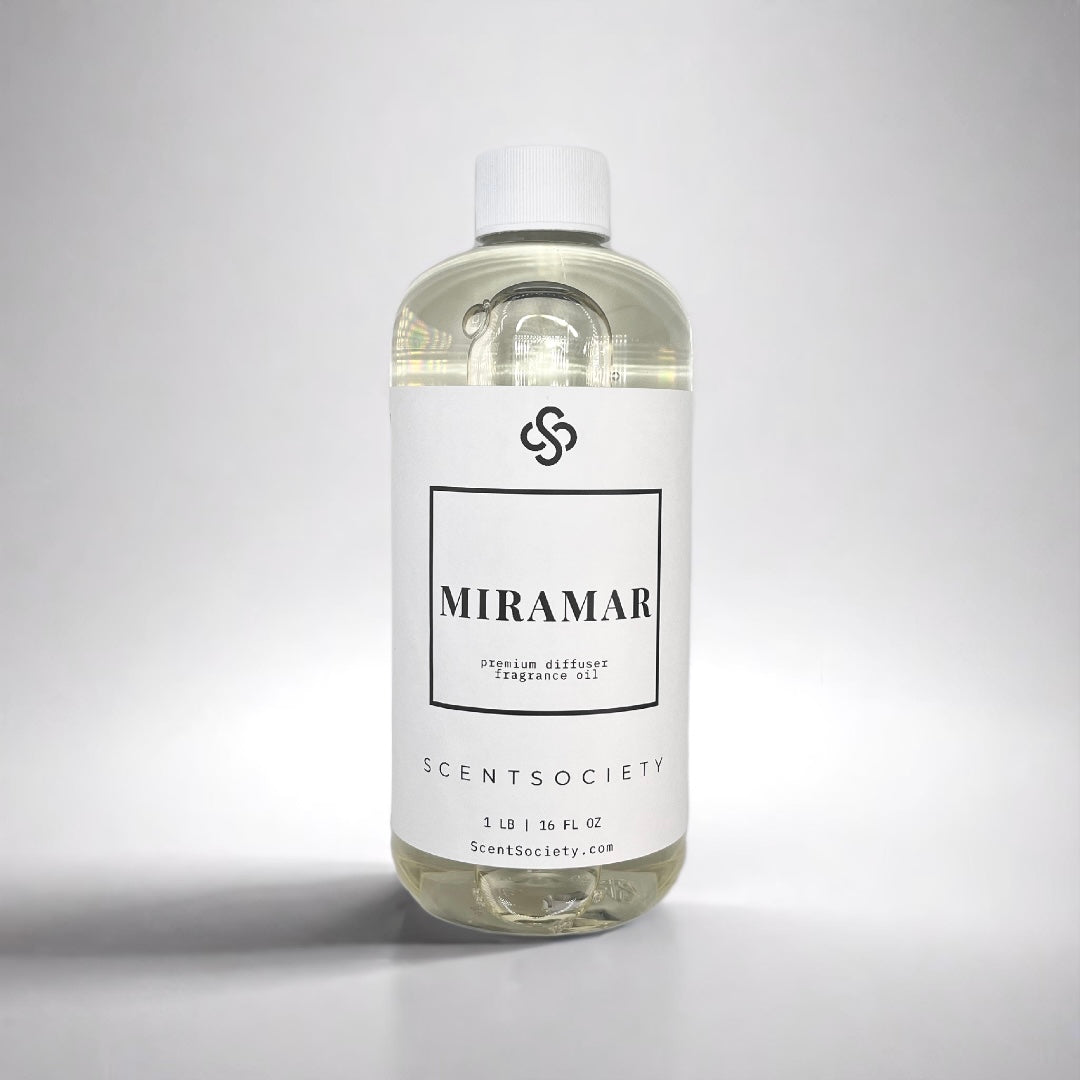 1LB bottle of Scent Society labeled 'MIRAMAR' diffuser oil on a neutral background. Clear plastic bottle with white cap and minimalist black-and-white label, filled with fragrance oil. Aromatherapy oil for use in cold air diffusers.