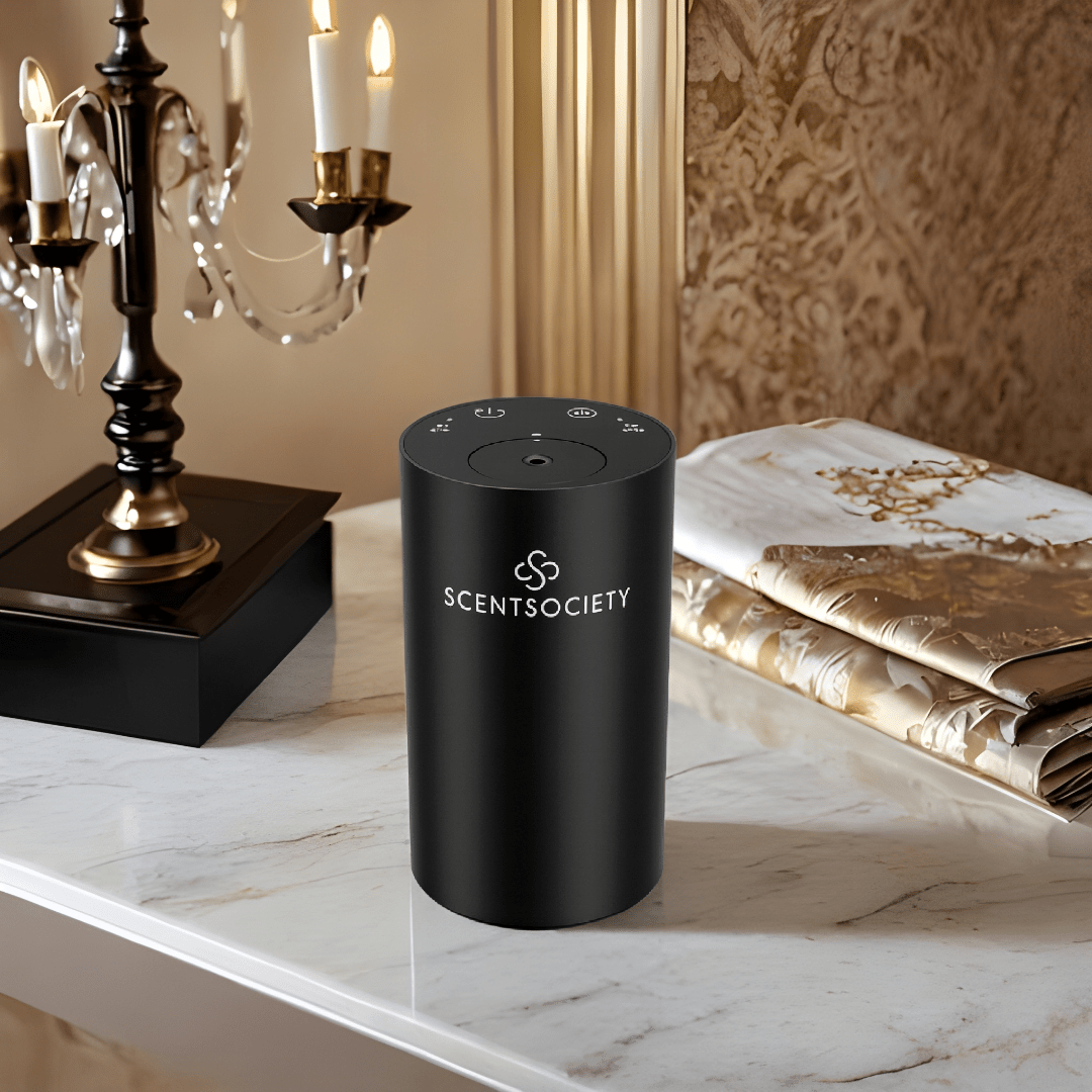 Black Scent Society fragrance diffuser on a marble surface with decorative background.