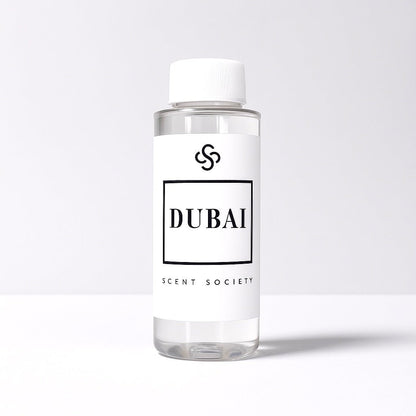Scent Society diffuser fragrance oil in clear 100ml bottle labeled Dubai, with white cap on neutral background.