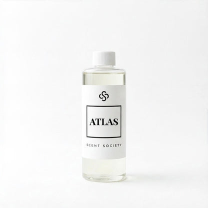 Scent Society Atlas diffuser oil bottle with clear glass, minimalist label, and white background