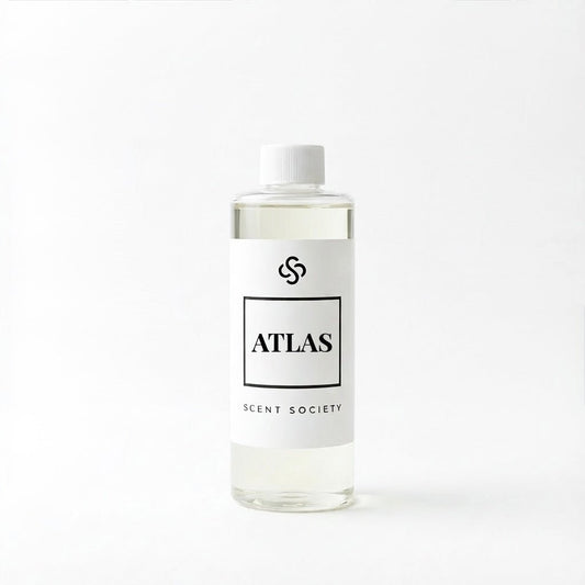 Scent Society Atlas diffuser oil bottle with clear glass, minimalist label, and white background
