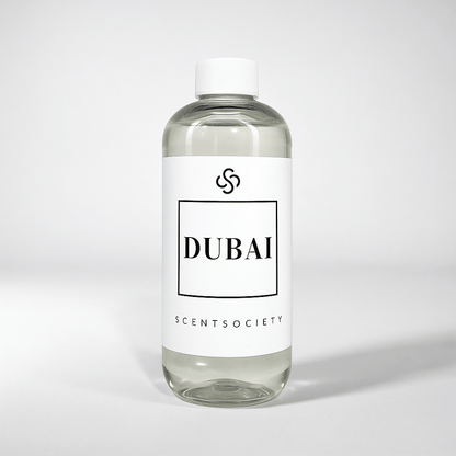Scent Society diffuser fragrance oil in clear 500ml bottle labeled Dubai, with white cap on neutral background.