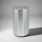 Silver cylindrical Scent Society Entrance Scent Diffuser device with a mirror top on a white background