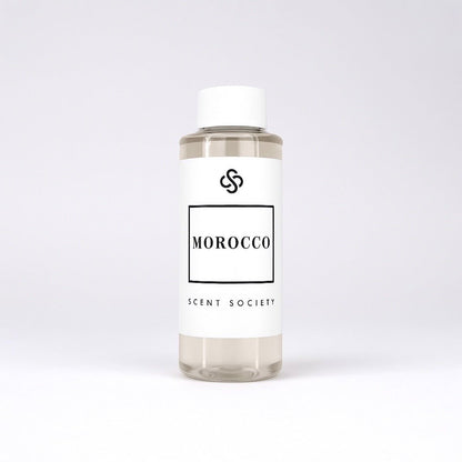 Scent Society diffuser fragrance oil in clear 100ml bottle labeled Morocco, with white cap on neutral background.