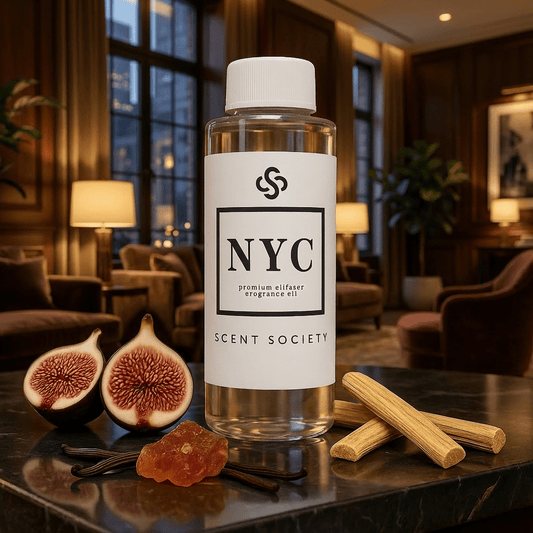 Bottle of NYC Scent Society diffuser oil in a moody luxurious hotel room background with figs and cinnamon sticks on a table.