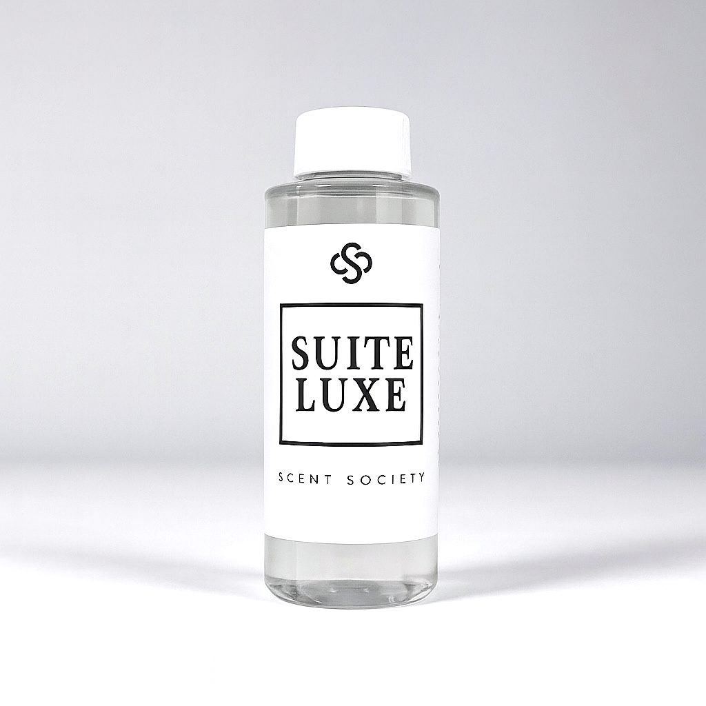 Scent Society diffuser fragrance oil in clear 100ml bottle labeled Suite Luxe, with white cap on neutral background.
