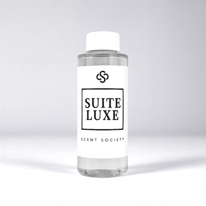 Scent Society diffuser fragrance oil in clear 100ml bottle labeled Suite Luxe, with white cap on neutral background.