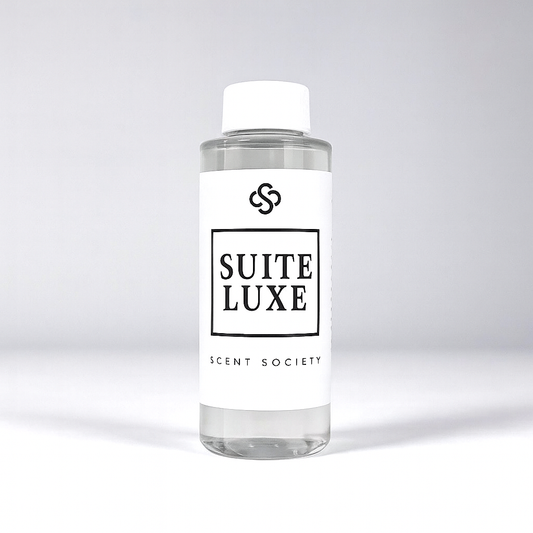 Scent Society diffuser fragrance oil in clear 100ml bottle labeled Suite Luxe, with white cap on neutral background.