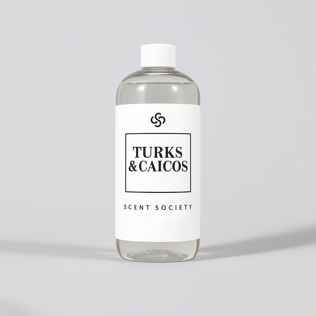 Scent Society diffuser fragrance oil in clear 500ml bottle labeled Turks & Caicos, with white cap on neutral background.