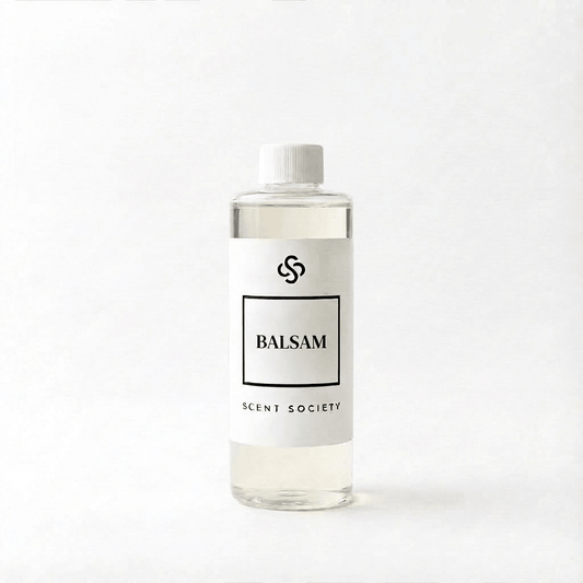 Scent Society Balsam diffuser oil bottle with clear glass, minimalist label, and white background