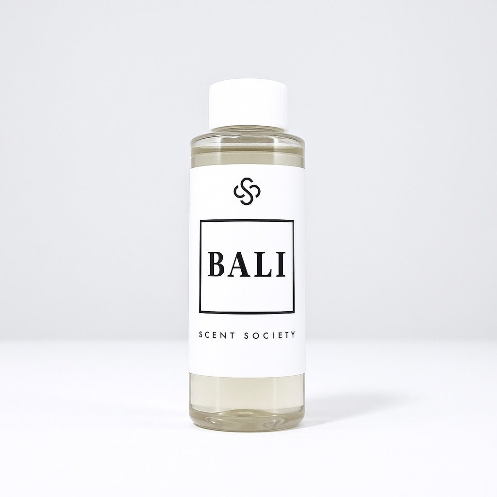 Scent Society diffuser fragrance oil in clear 100ml bottle labeled Bali, with white cap on neutral background.