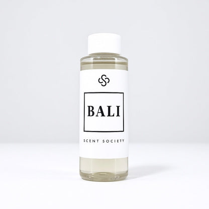 Scent Society diffuser fragrance oil in clear 100ml bottle labeled Bali, with white cap on neutral background.
