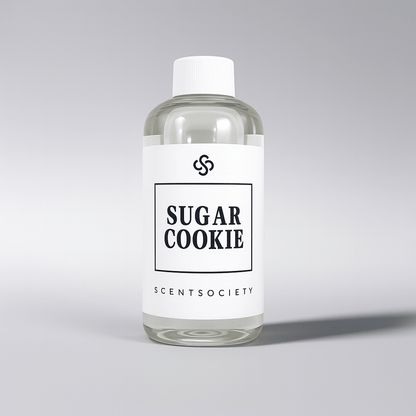 Clear bottle of 'Sugar Cookie' diffuser oil by Scent Society on a gray background