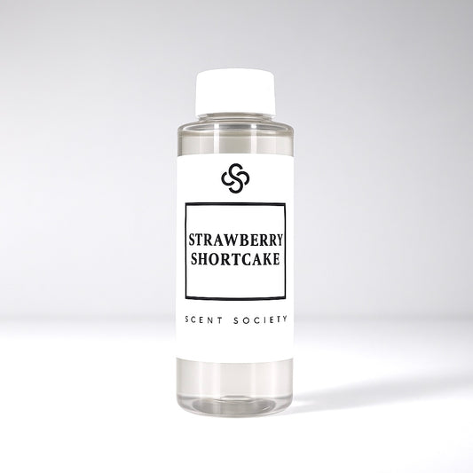 Scent Society diffuser fragrance oil in clear 100ml bottle labeled Strawberry Shortcake, with white cap on neutral background.