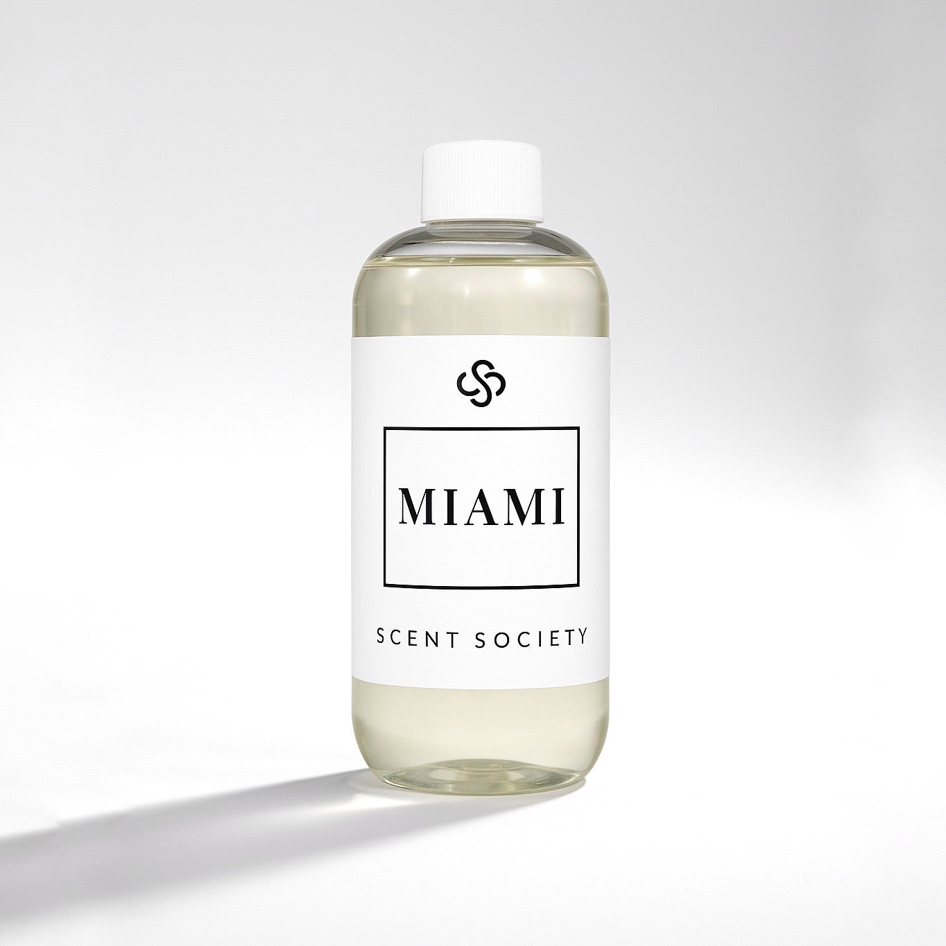Scent Society diffuser fragrance oil in clear 500ml bottle labeled Miami, with white cap on neutral background.