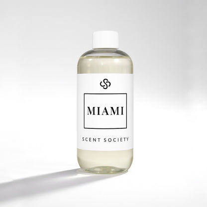 Scent Society diffuser fragrance oil in clear 500ml bottle labeled Miami, with white cap on neutral background.