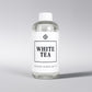 Scent Society diffuser fragrance oil in clear 500ml bottle labeled White Tea, with white cap on neutral background.