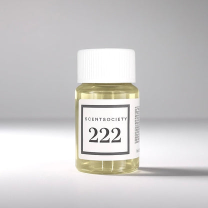 20 ml bottle of Scent Society labeled '222' diffuser oil on a neutral background. Clear plastic bottle with white cap and minimalist black-and-white label, filled with fragrance oil. Aromatherapy oil for use in cold air diffusers.