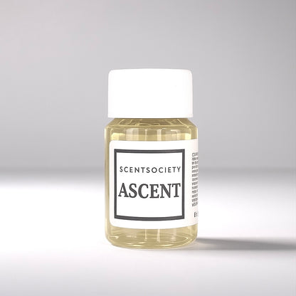 20ml bottle of Scent Society labeled 'ASCENT' diffuser oil on a neutral background. Clear plastic bottle with white cap and minimalist black-and-white label, filled with fragrance oil. Aromatherapy oil for use in cold air diffusers.