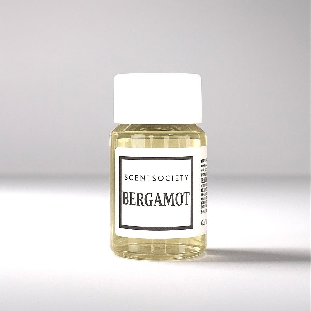 20ml bottle of Scent Society labeled 'BERGAMOT' diffuser oil on a neutral background. Clear plastic bottle with white cap and minimalist black-and-white label, filled with fragrance oil. Aromatherapy oil for use in cold air diffusers.