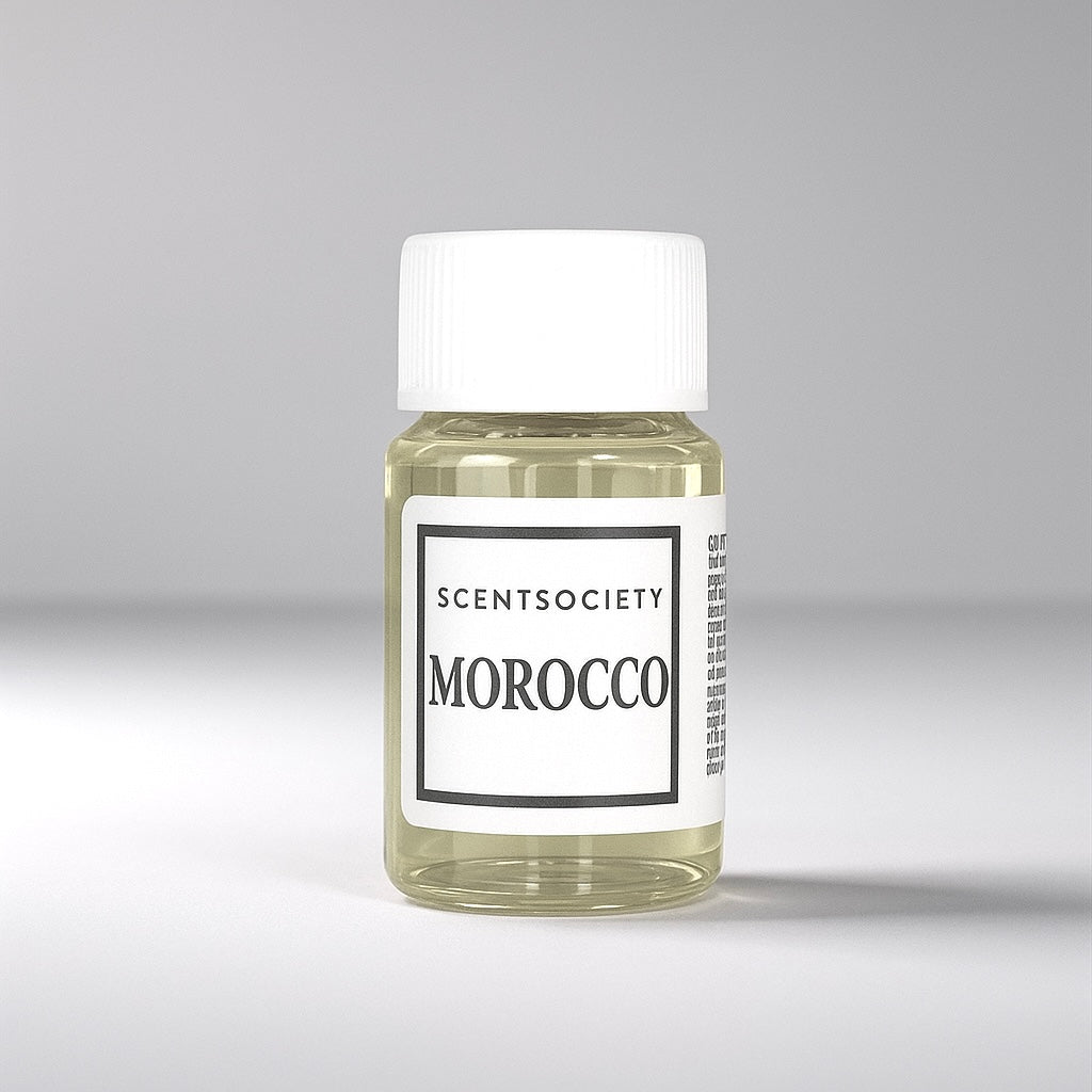 20ml bottle of Scent Society labeled 'MOROCCO' diffuser oil on a neutral background. Clear plastic bottle with white cap and minimalist black-and-white label, filled with fragrance oil. Aromatherapy oil for use in cold air diffusers.