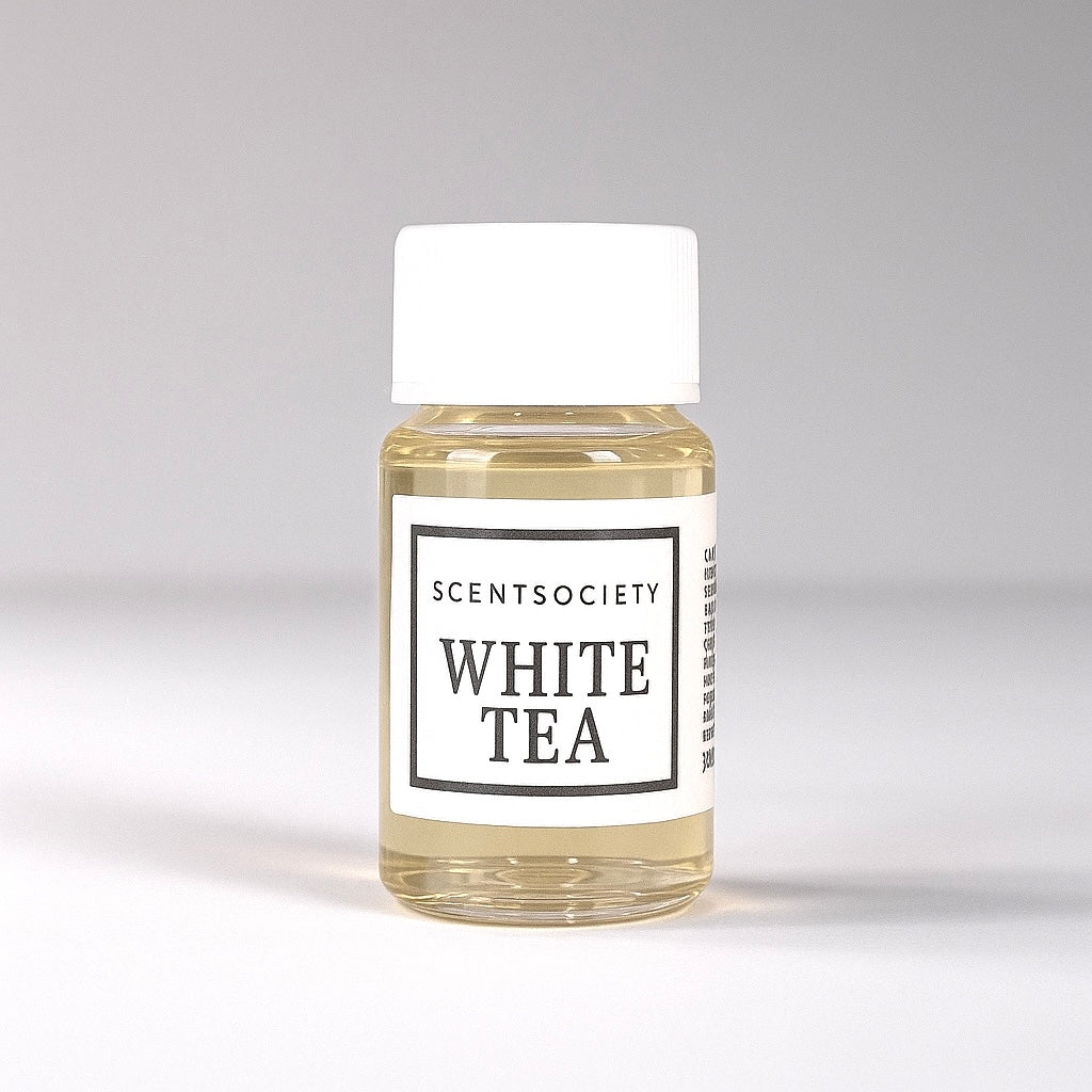 20ml bottle of Scent Society labeled 'WHITE TEA' diffuser oil on a neutral background. Clear plastic bottle with white cap and minimalist black-and-white label, filled with fragrance oil. Aromatherapy oil for use in cold air diffusers.