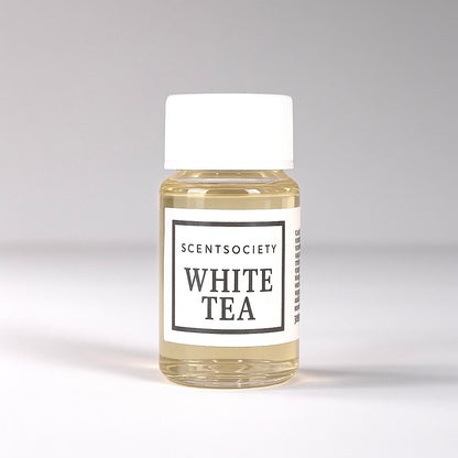 20ml bottle of Scent Society labeled 'WHITE TEA' diffuser oil on a neutral background. Clear plastic bottle with white cap and minimalist black-and-white label, filled with fragrance oil. Aromatherapy oil for use in cold air diffusers.