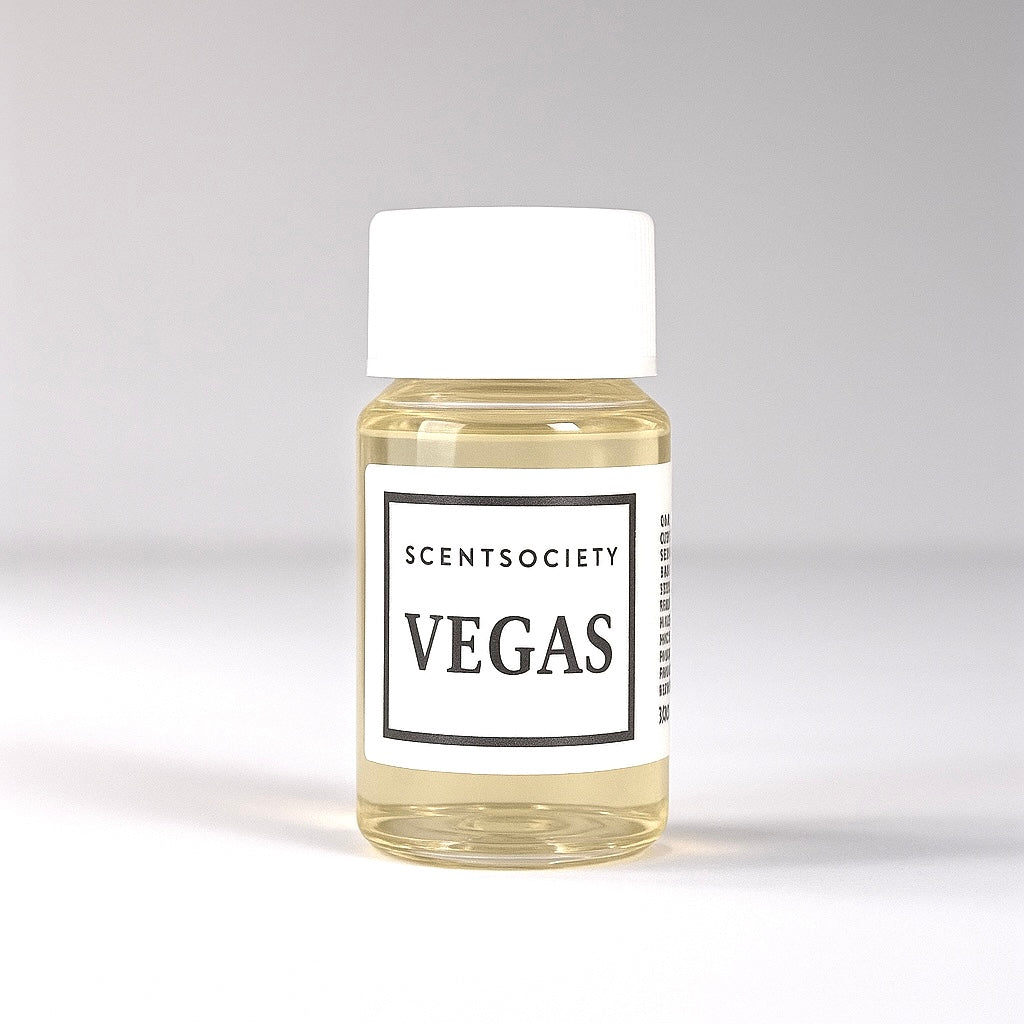 20ml bottle of Scent Society labeled 'VEGAS' diffuser oil on a neutral background. Clear plastic bottle with white cap and minimalist black-and-white label, filled with fragrance oil. Aromatherapy oil for use in cold air diffusers.