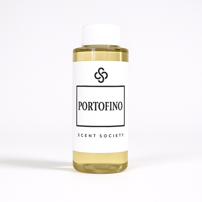 100ml bottle of Scent Society labeled 'PORTOFINO' diffuser oil on a neutral background. Clear plastic bottle with white cap and minimalist black-and-white label, filled with fragrance oil. Aromatherapy oil for use in cold air diffusers.
