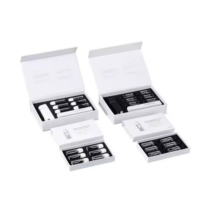 Four Sets of white and black Scent Society car vent scent oil diffusers, fragrance oils  and accessories in open boxes on a white background