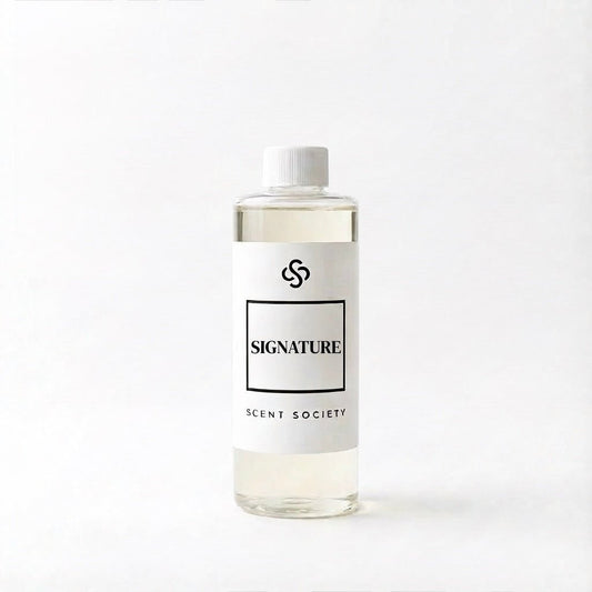 Scent Society Signature diffuser oil bottle with clear glass, minimalist label, and white background