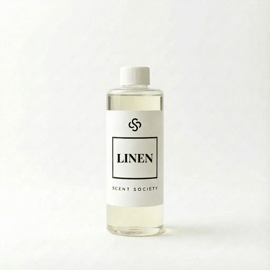 Scent Society Linen diffuser oil bottle with clear glass, minimalist label, and white background