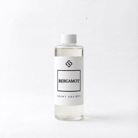 Scent Society Bergamot clear diffuser oil with a white cap and label on a white background.