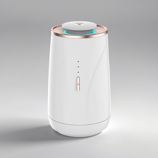 Scent Society Valet portable white car diffuser with rose gold trim, ED indicator lights, and a top-mounted mist outlet, shown on a neutral gray background.