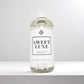 Scent Society diffuser fragrance oil in clear 500ml bottle labeled Sweet Luxe, with white cap on neutral background.