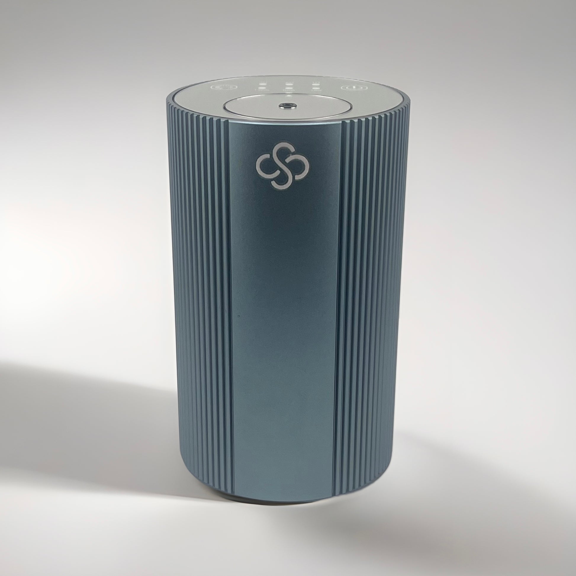 Slate Gray cylindrical Scent Society Entrance Scent Diffuser device with a mirror control top on a white background