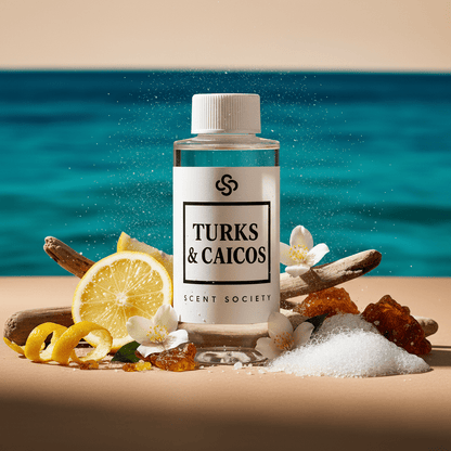 Bottle of Turks & Caicos Scent Society product with lemons, flowers, and sand on a beach background