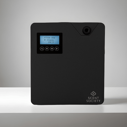 Scent Society Founder large-capacity black diffuser machine with build-in LCD screen, control buttons, and wall-mountable design, shown on a neutral background for commercial or whole-home scenting use.