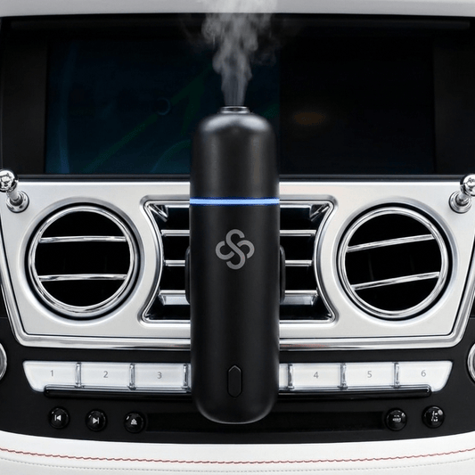 Scent Society Car Club Diffuser Oil attached to car vent clip emitting diffusing scent