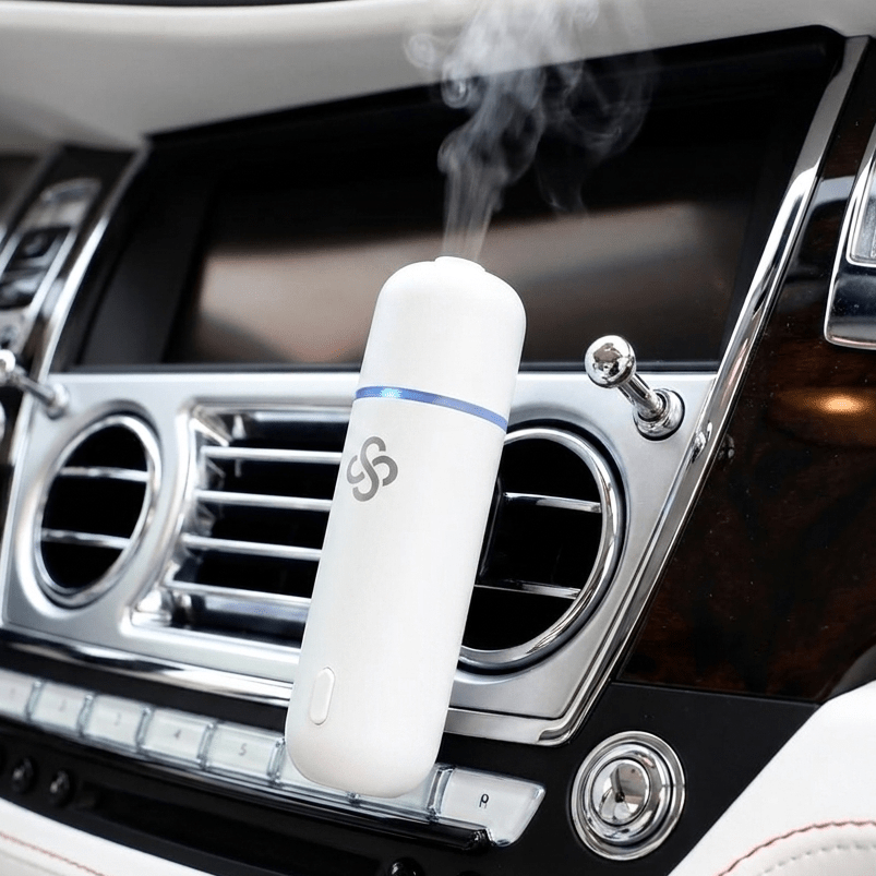 Scent Society White Car Club Diffuser Oil attached to car vent clip emitting diffusing scent